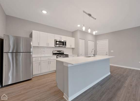 Apartment Kitchen with Island and Stainless Steel Appliances