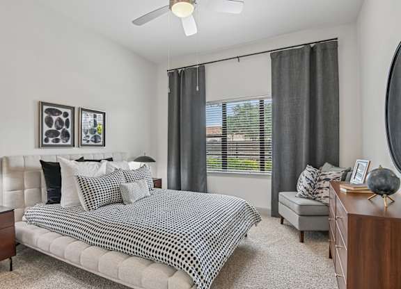 Markethaus 3700 A bedroom with a bed, nightstand, and a window with curtains.