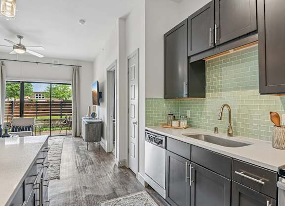 Markethaus 3700 A modern kitchen with dark wood cabinets and a white countertop.