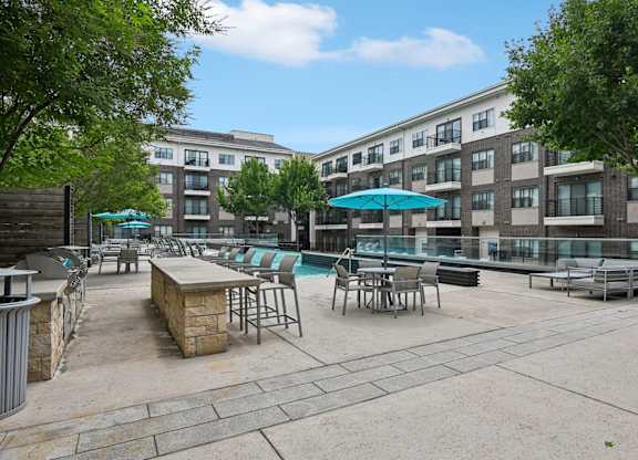 Pool Deck with Umbrellas and Grilling Station Markethaus 3700