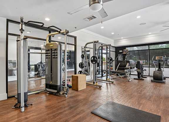 Markethaus 3700 A gym with a variety of equipment including a treadmill, weights, and a bench press.