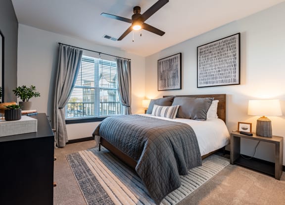 Cozy Bedroom with Carpeting & Ceiling Fan