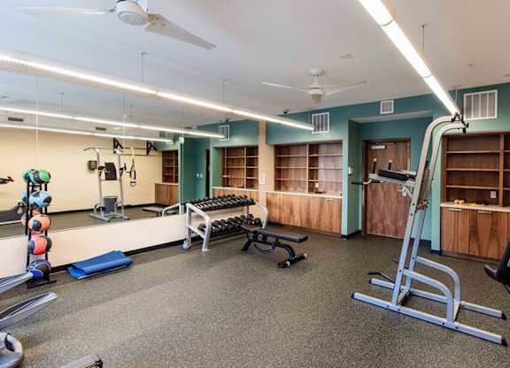 Fitness Center with Free Weights, Bench and leg lift bar.