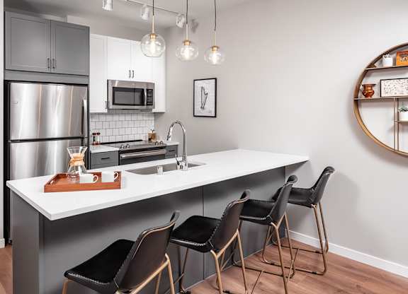 Modern kitchen with granite countertops at The Harper