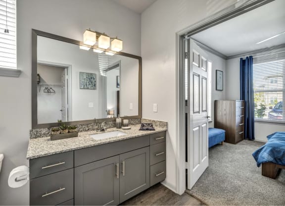 a view of a room with mirrors and counter tops