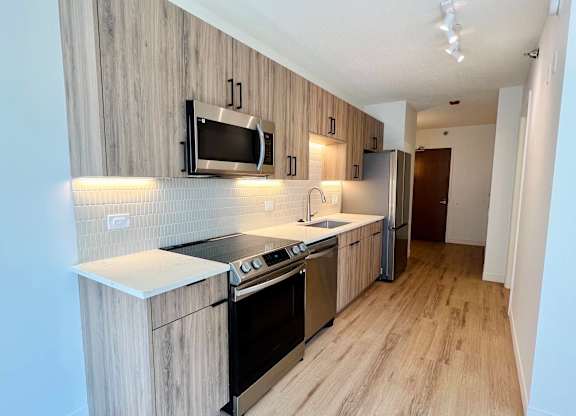 a kitchen with a stove and a microwave