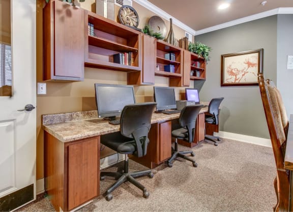 Business Center with three computers and working desk