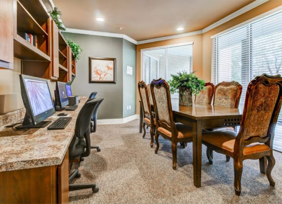 Business Center with conference table and computers