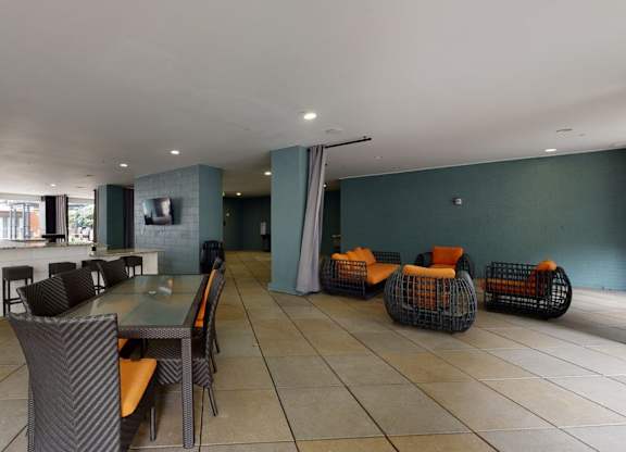 A large room with tables and chairs.