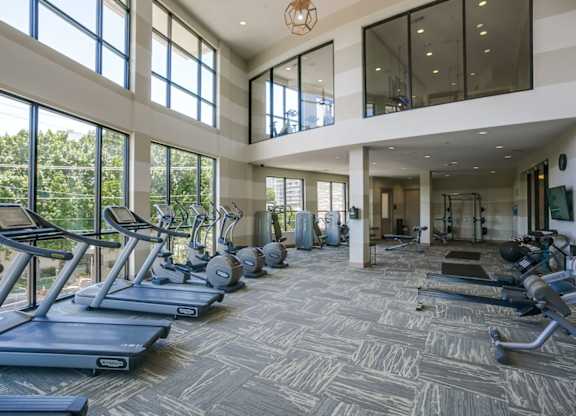 A spacious gym with treadmills and exercise equipment.