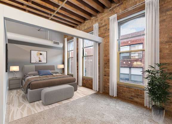 A bedroom with a large bed and a couch.
