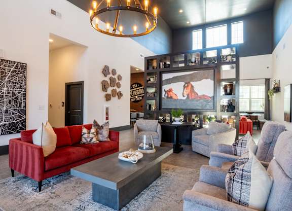 A living room with a red couch and a coffee table.