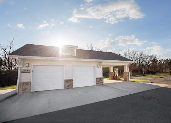 A two-car garage with the sun shining through the roof.