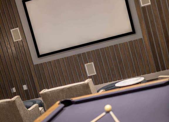 A pool table with a cue stick and balls.