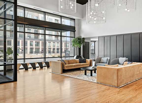 A modern living room with a large window and a view of a cityscape.