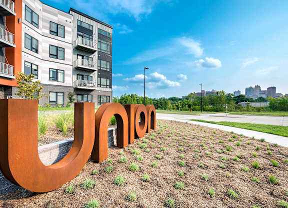 A large brown sculpture spelling out the word
