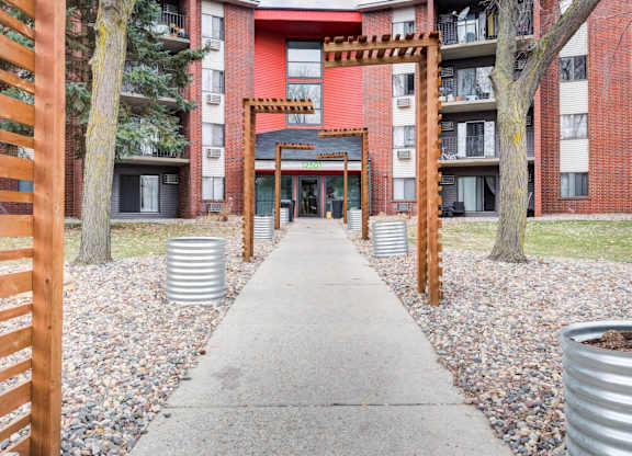 A red building with a wooden gate in front.