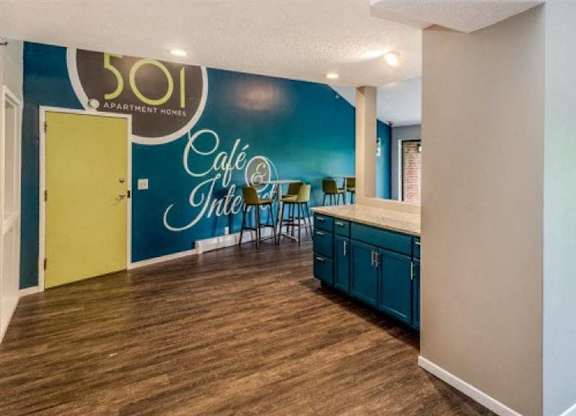 A room with a blue wall and a yellow door.