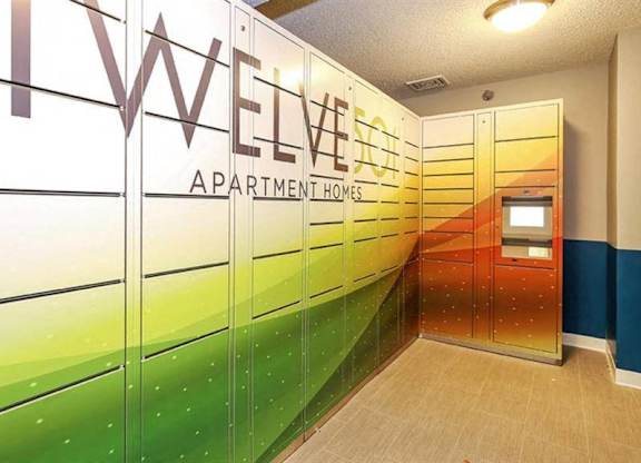 A hallway with a green and orange wall and a sign that says twelve.