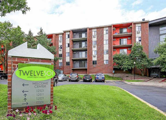 A sign in front of a building that says "Twelve" on it.