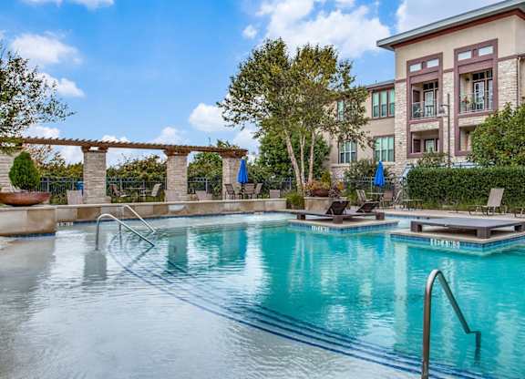 Outdoor pool and lounge area at Twin Creeks Crossing, Allen apartments