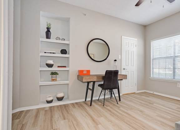 A room with a desk and chair at The Lana in North Dallas.