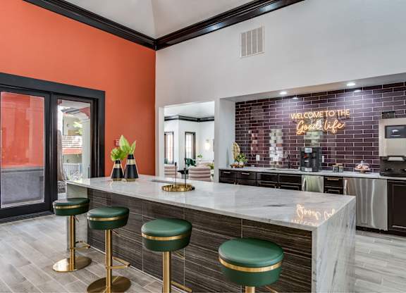 Clubhouse interior with lounge seating at The Lana, Dallas apartments