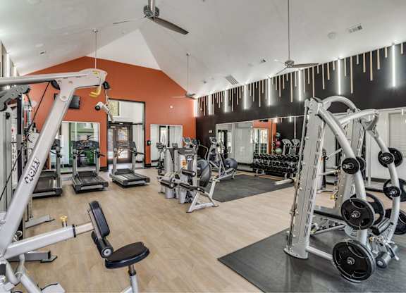 Fitness center with cardio and strength equipment at The Lana, luxury apartments in North Dallas