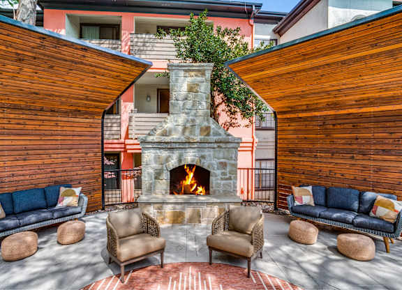 Resident patio with fireplace at The Lana, apartments in Dallas, TX