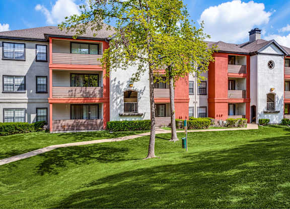 The Lana Dallas apartments surrounded by mature trees and green spaces