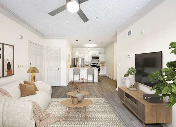 A living room with a white couch and a wooden coffee table.
