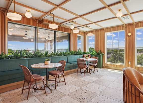 A sunny patio with a table and chairs.
