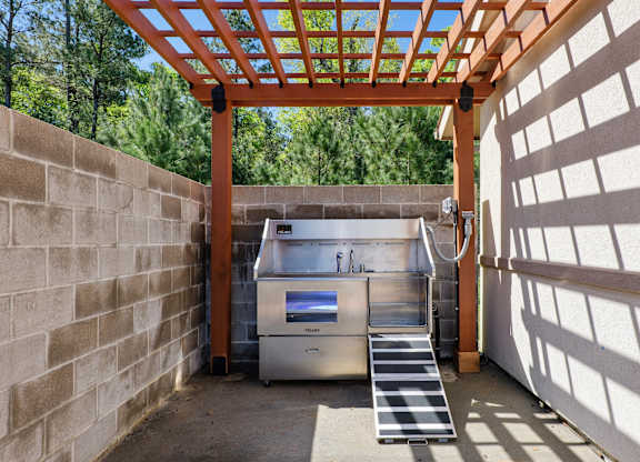Dog wash station next to the Dog Park with shaded pergola.