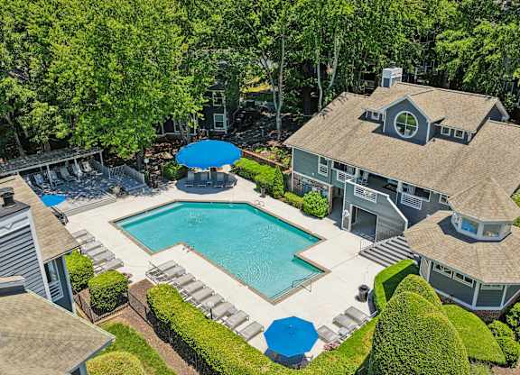 A large house with a pool in the backyard.