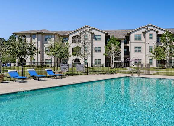 Large pool with sun chairs