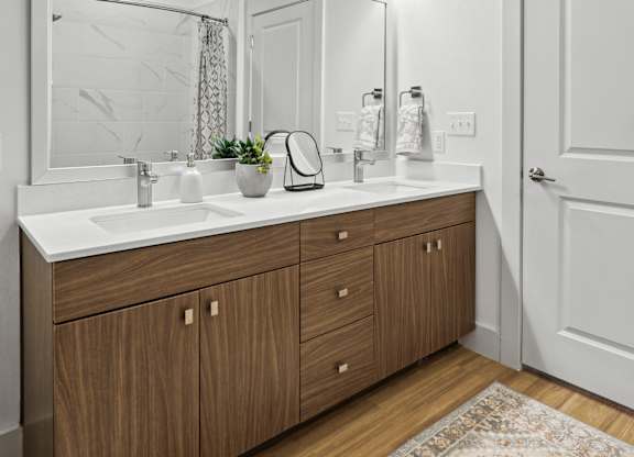 a bathroom with a large mirror and a sink