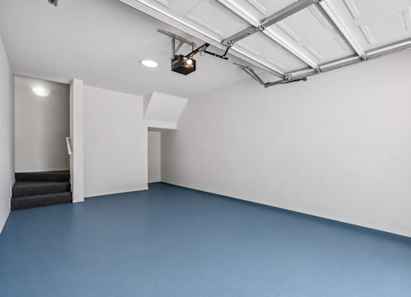 one car garage with blue flooring at St Moritz in Dallas Texas