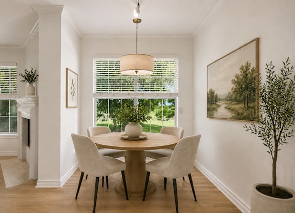A dining room with a table at St Moritz in Dallas Texas