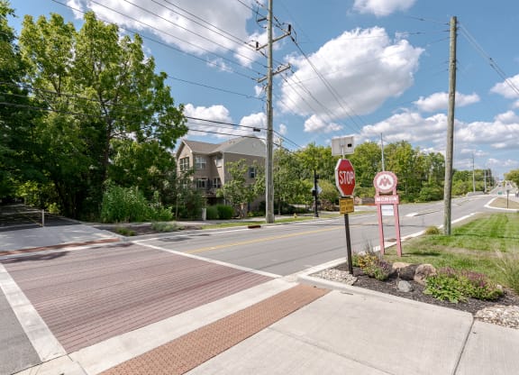 an empty street with a stop sign at an intersection