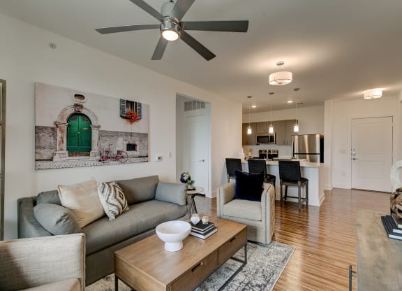 a living room with a couch and two chairs