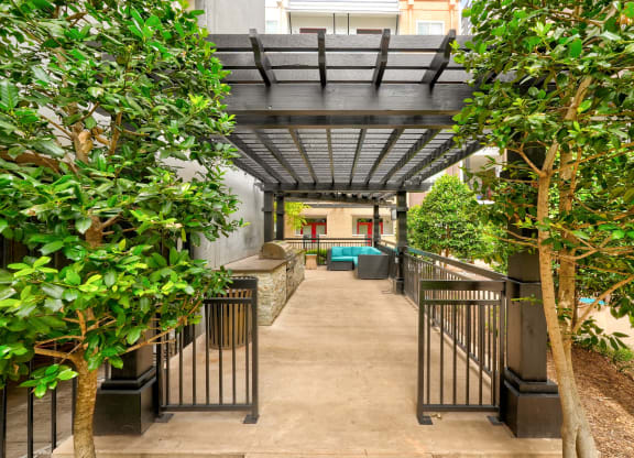 a view of a corridor with trees and a staircase