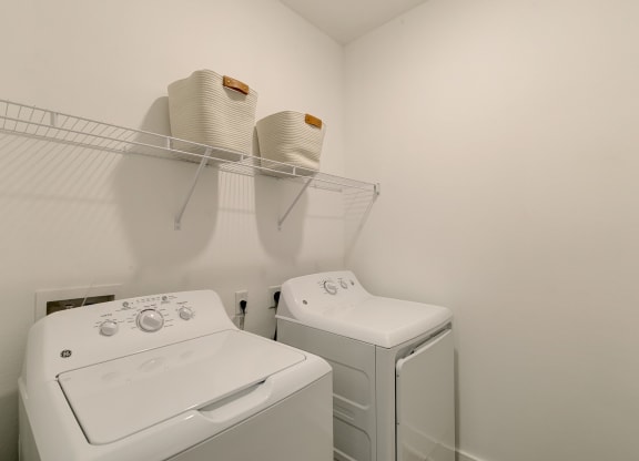 a laundry room with a washer and dryer