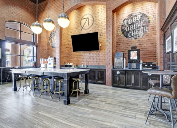a restaurant with tables and chairs and a tv on the wall
