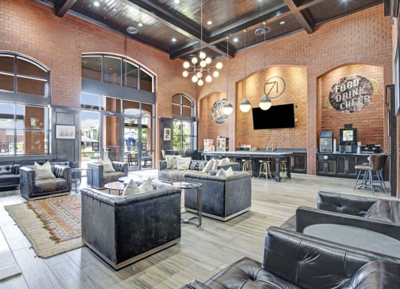 a living room with couches and chairs and a tv