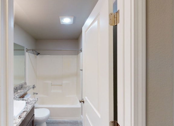 a bathroom with a toilet and a sink