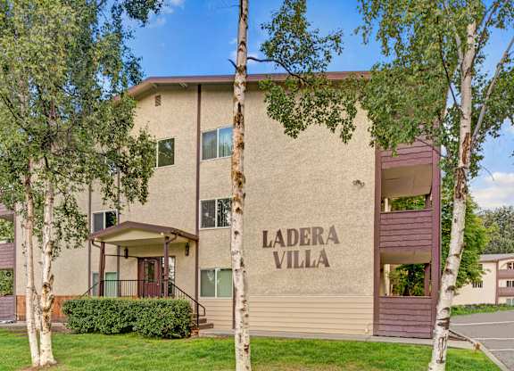 The Ladera Villa apartment building with a large wall printing the name