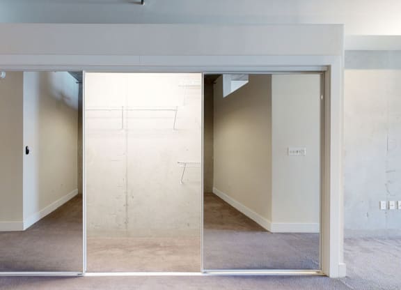 an empty room with a wall that has been painted white