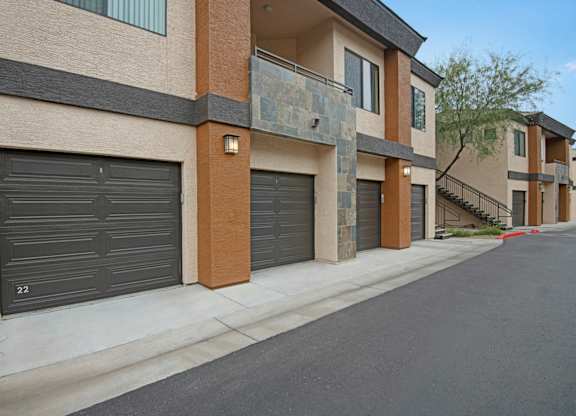A row of houses with garage doors closed.