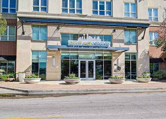 The front of a building with a glass entrance and a sign that reads "CircllaChez".