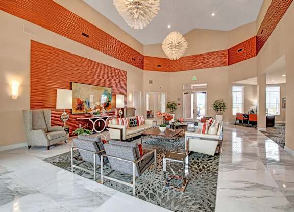 A living room with a large grey sofa and a coffee table.